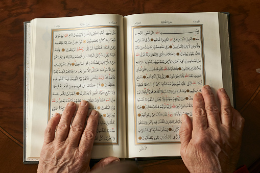 Senior Woman Reading the Holy Koran