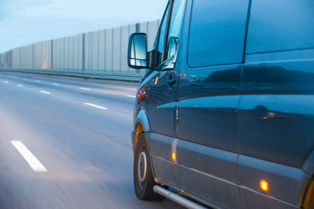 istock blue bus rides on the highway 1126265978