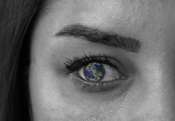 istock Earth in woman's eye 1126273575