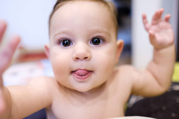 istock Baby picking up the camera 1126288648