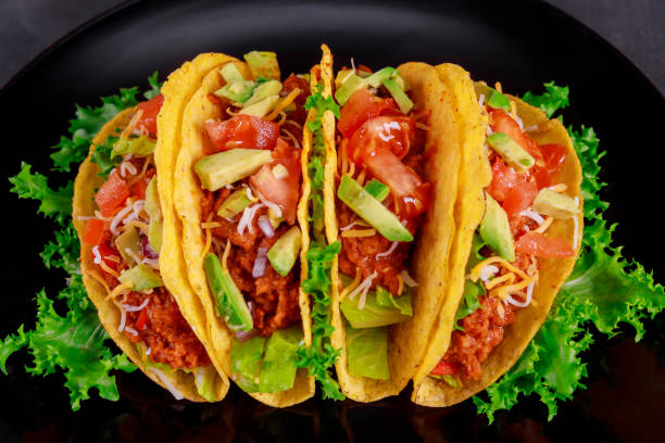 istock Vegetarian taco wraps. Vegetable tacos ingredients on top view 1126290856