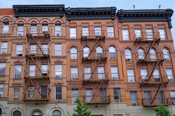 istock old New York apartment building with external fire escape ladders 1126296919