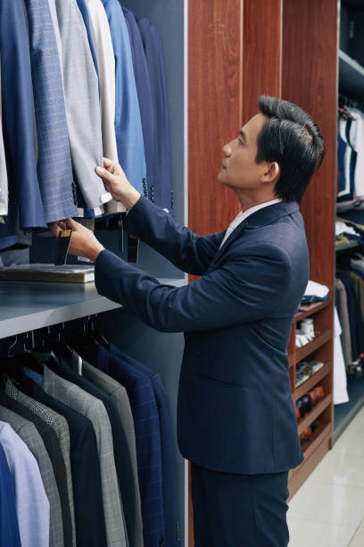 istock Businessman choosing suit 1126306329