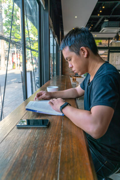 istock Asian man read a book in the morning 1126306844