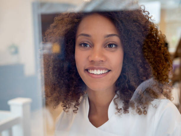 istock Business owner looking through the window at a spa 1126310651