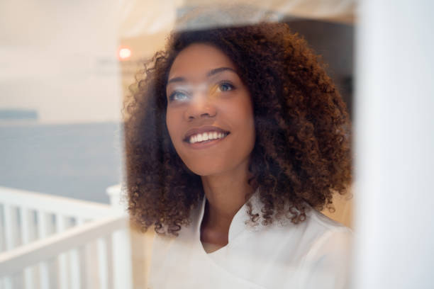 istock Thoughtful business owner looking through the window at a spa 1126310667