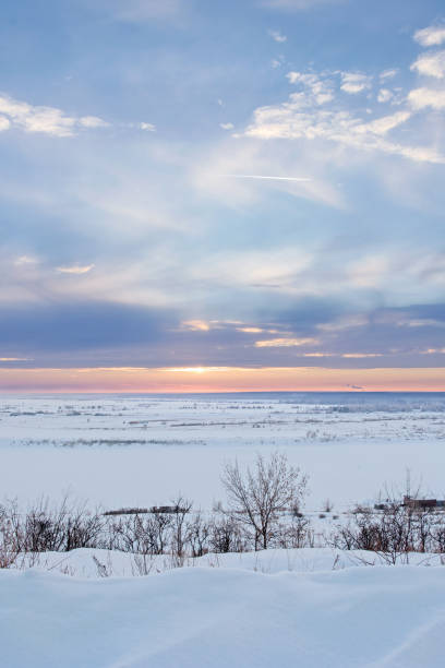 istock Winter Sunset Scene: Frosty Landscape with Snowdrift and Trees and Tranquil Sky 1126312366