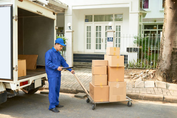 Delivery service worker loading truck Delivery service worker loading his truck with cardboard boxes company relocation stock pictures, royalty-free photos & images