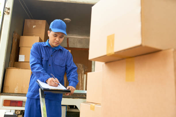 Delivery man loading truck stock photo