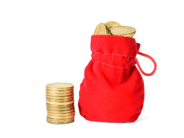 istock Small stack of coins and pouch with coins isolated on white background. 1126312611