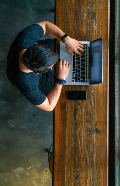 istock Top view of Asian man working on laptop 1126314143
