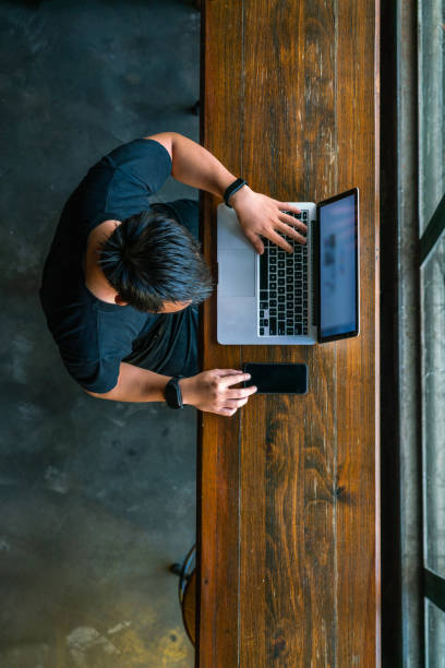 istock Vertical photo of young man using smartphone 1126314271