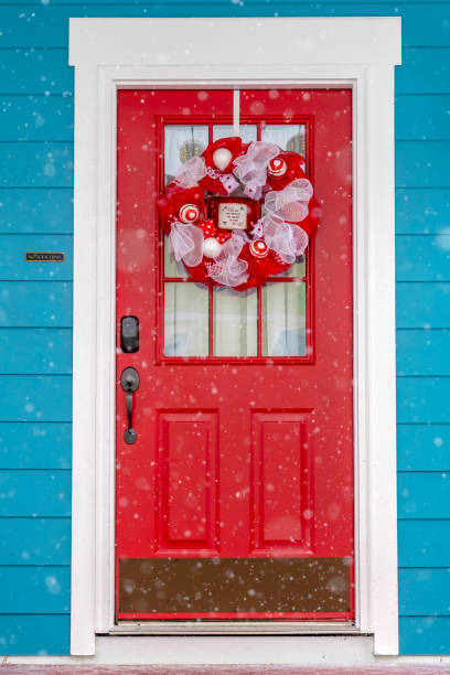 istock Vibrant red glass paned front door with wreath 1126321576
