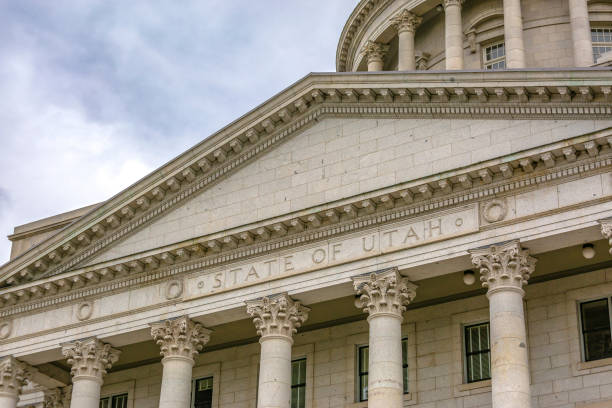 State of Utah Capital Building with sky background. Close up view of the historic State of Utah Capital Building in Salt Lake City. A vast sky with clouds can be seen behind the famous landmark.