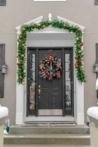 istock Festive doorway decorated with garland and wreath 1126321584