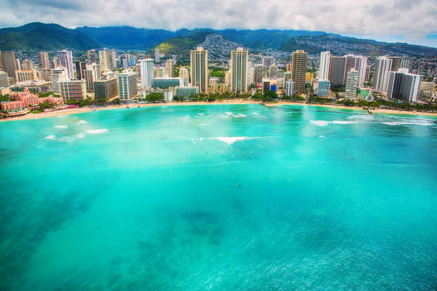 Waikiki Beach The beautiful Waikiki Beach of Honolulu, Hawaii shot from an altitude of about 1000 feet over the Pacific Ocean. honolulu stock pictures, royalty-free photos & images