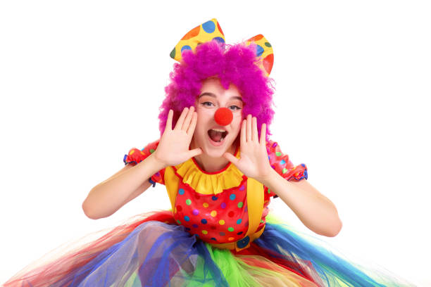 happy young clown girl on white background - clowns nose imagens e fotografias de stock