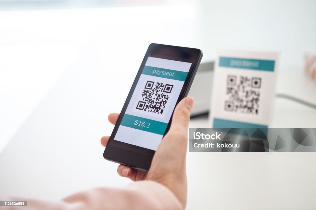 Electronic settlement with bar code reader QR Code Stock Photo