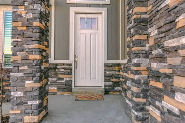 istock Facade of a home with white wall and brick wall 1126332281