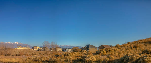 istock Homes on a hill against moountain and sky in Utah 1126332339