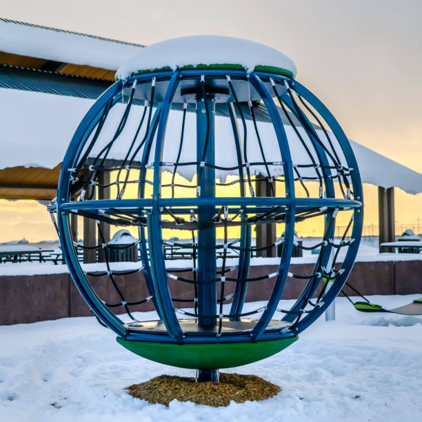 istock Globe climbing frame on a snowy playground in Utah 1126332385
