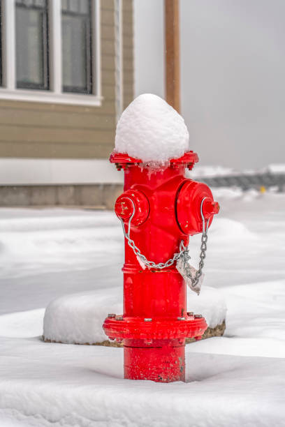 istock Red fire hydrant on ground with a blanket of snow 1126335529