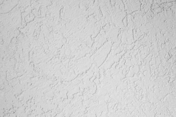 istock Texture of a white decorative plaster or concrete wall. 1126335717