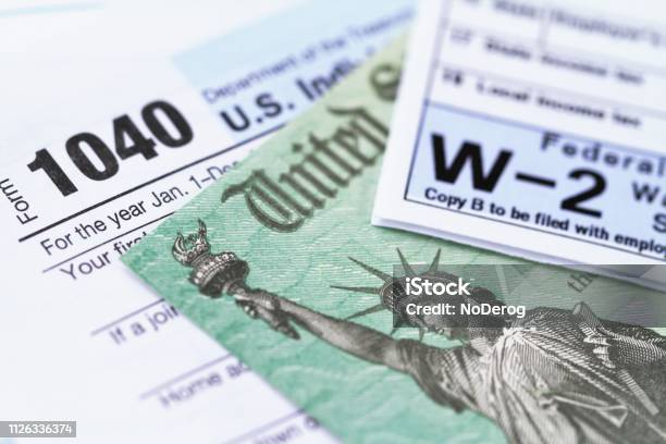 Irs Tax Forms With Tax Refund Check Stock Photo - Download Image Now - Tax Form, Tax, Internal Revenue Service