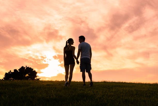 istock Couple holding hands in the sunset 1126337217
