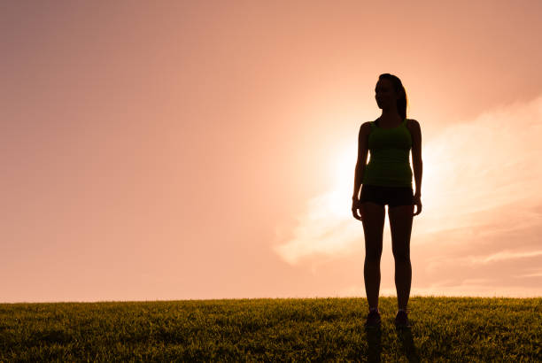 istock Woman at sunset 1126337353