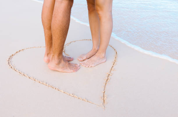 istock Romantic couple kissing on the beach 1126337401