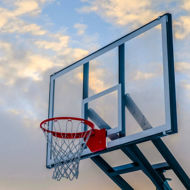 istock Basketball basket on transparent board against sky 1126337598
