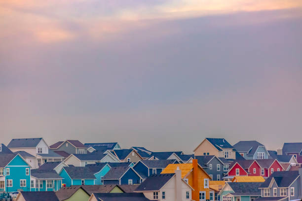Colorful homes in Daybreak with sky in background. Colorful multi-storey homes in Daybreak, Utah with a vast cloudy sky in the background. Beautiful Utah Valley landscape with charming homes.