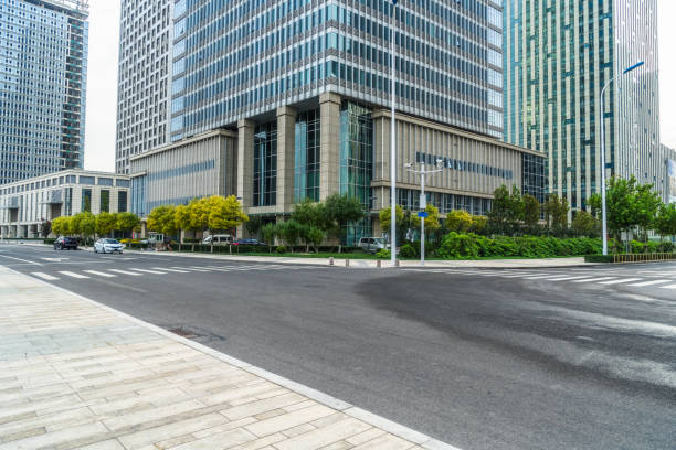 istock empty asphalt road front of modern buildings 1126339539