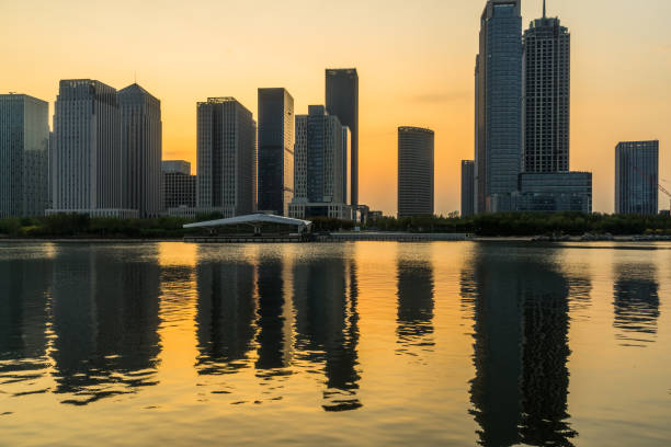 istock Modern buildings near water at dusk 1126339553