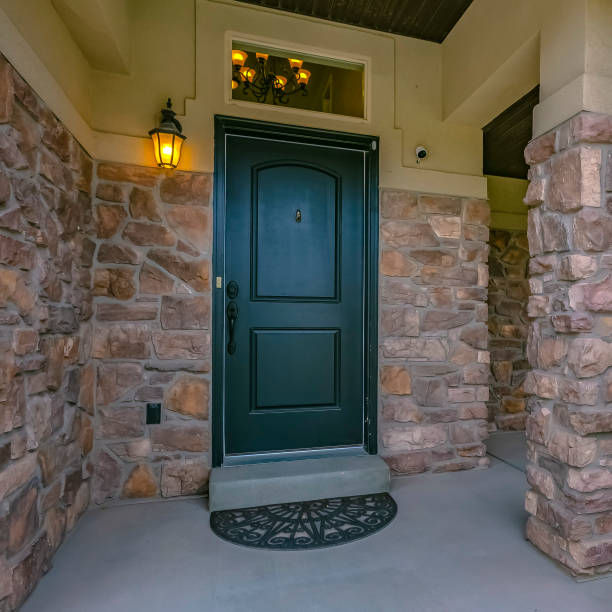 istock Eagle Mountain home with green door and stone wall 1126339600