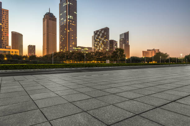 istock Empty brick floor with city skyline background 1126339783