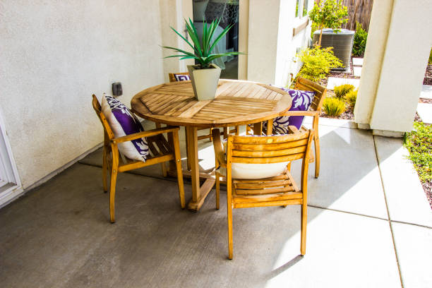 istock Round Wooden Patio Table With Chairs 1126347581