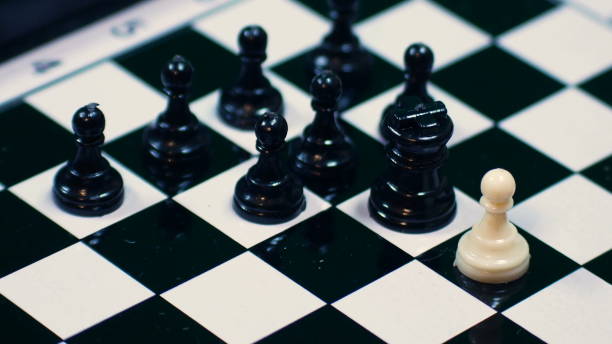 istock white chess pieces lined up against all black pawns, ideal footage to represent problems of integration, violence and racism 1126353431