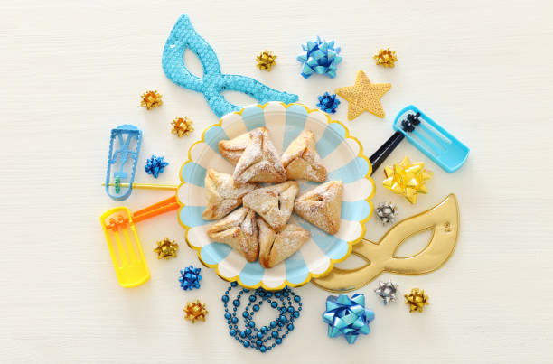 istock Purim celebration concept (jewish carnival holiday) over white wooden background. Top view, Flat lay. 1126360156