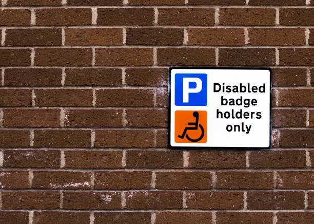 istock Disabled badge holders only sign on a brick wall 1126361189