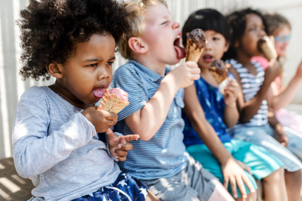istock Kids eating ice cream in the summer 1126362921
