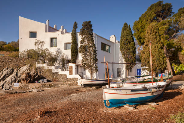 Salvador Dali Home Museum 18 April 2015: Port Lligat, Catalonia, Spain - Casa Museo Salvador Dali , the former house and studio of the artist. Boats moored nearby. salvador dali stock pictures, royalty-free photos & images
