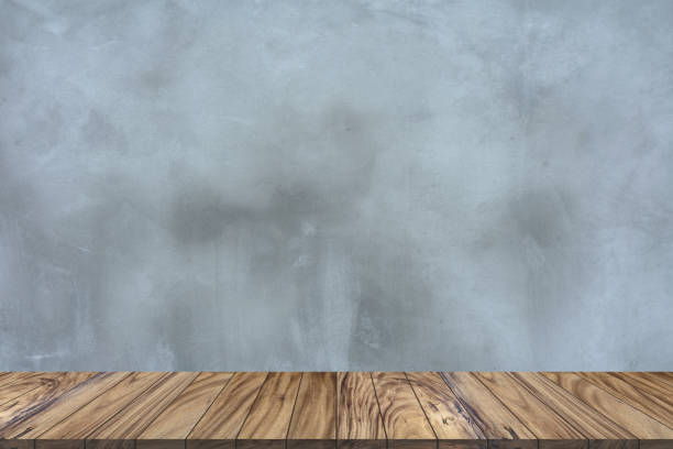 istock Top wood table perspective on gray cement wall background. 1126367271