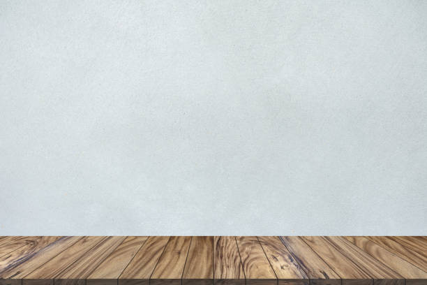 istock Top wood table perspective on gray cement wall background. 1126367275