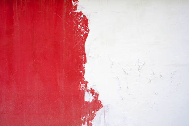 texture of the wall is half white, half red.