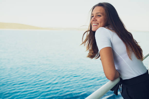istock Beautiful Young Woman Enjoying Summer Breeze 1126369340