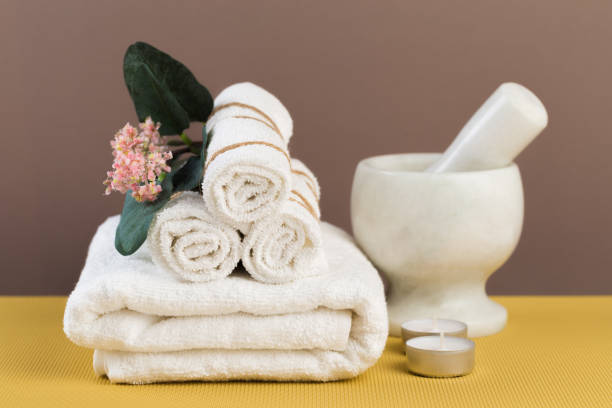 istock Spa still life with aromatic candles, flower and towel. - Image 1126370741