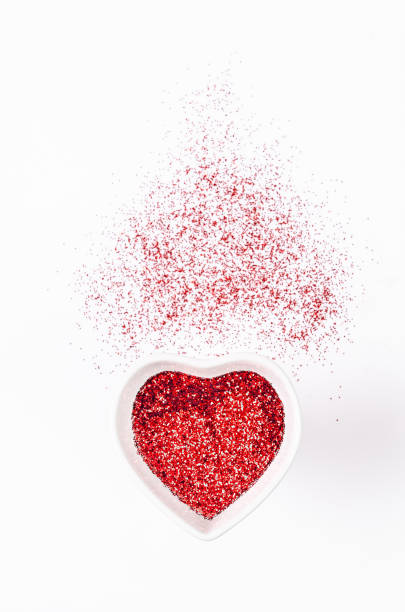 istock Heart shape made of red glitter on bright background 1126371554