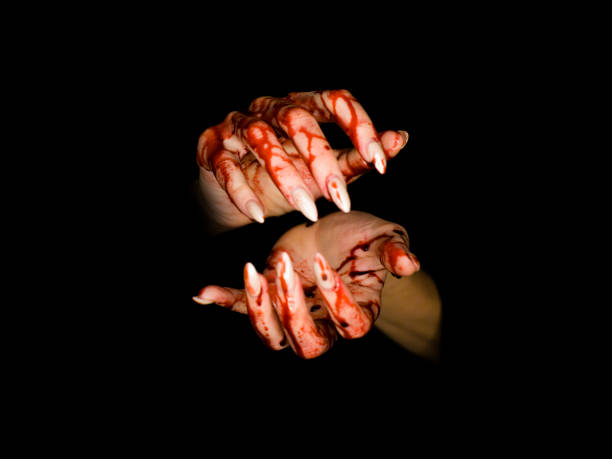 istock Scary bloody hands isolated on dark background. Halloween, witch, horror concept. 1126371943